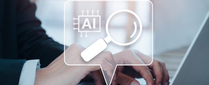 Eine Person tippt auf einem Laptop, darüber schwebt ein grafisches Symbol mit einem KI-Chip und einer Lupe für künstliche Intelligenz-Suche.