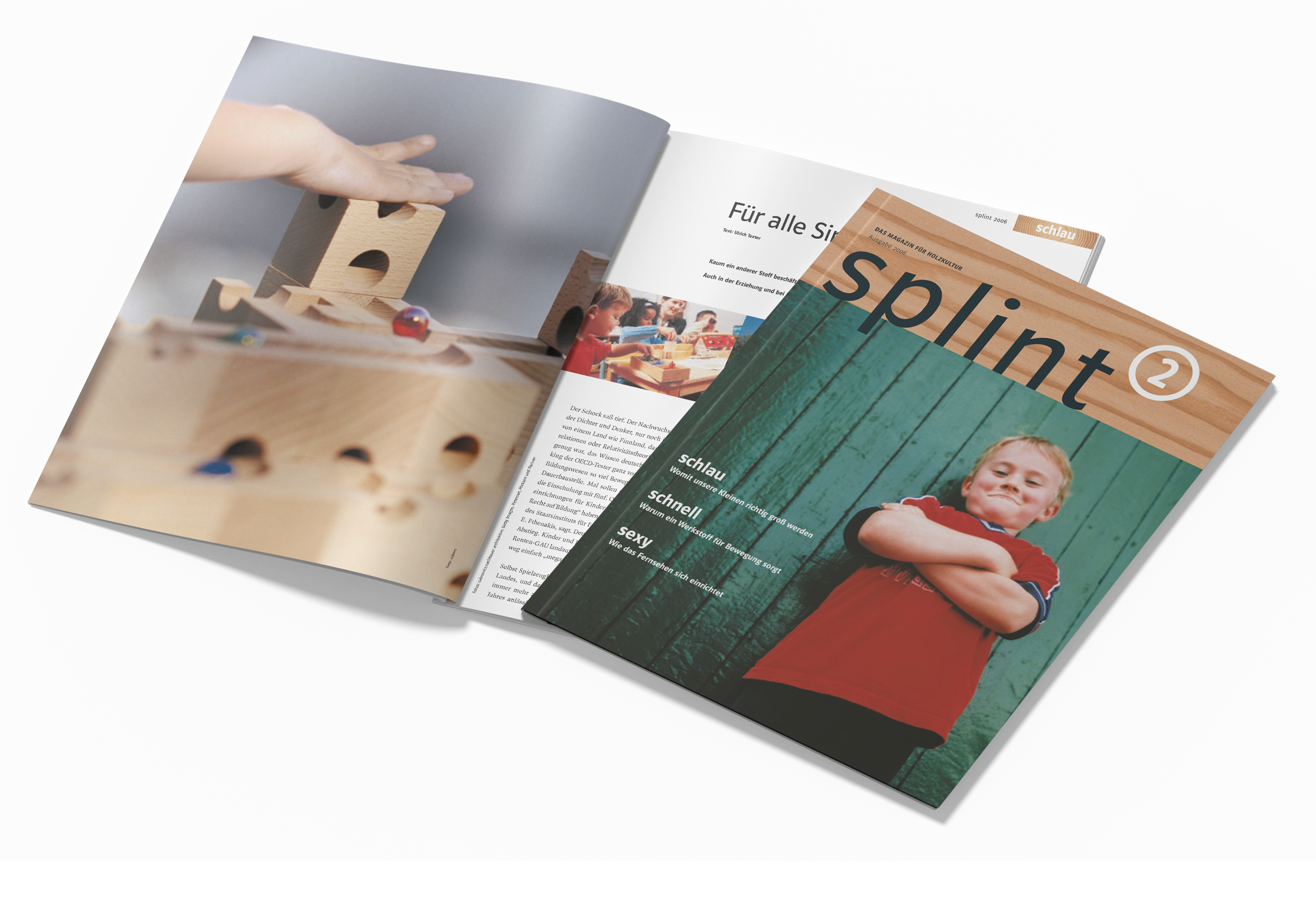 HAF-splint Ein aufgeschlagenes Magazin namens splint mit einem Foto von spielenden Kindern und einer Titelseite mit einem Jungen vor einer grünen Holzwand.